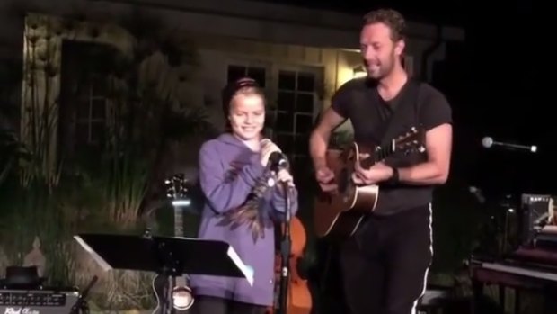 Moses Martin performing with his famous Coldplay frontman father at a gig in Malibu.
