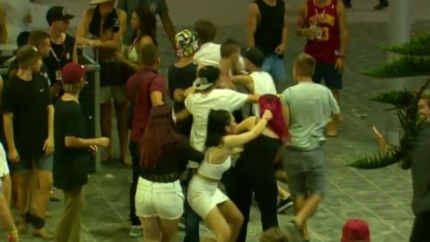 A brawl breaks out during schoolies celebrations on the Gold Coast.