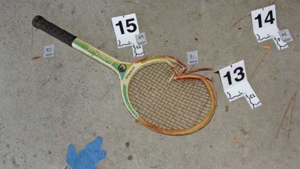The broken tennis racquet found at the crime scene.