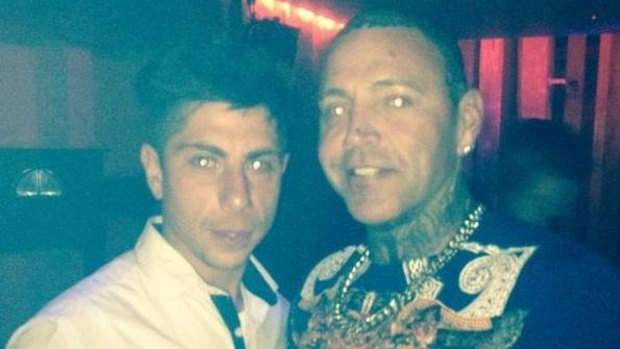 Mahamd Hassan (left) posing with former bikie Toby Mitchell. 