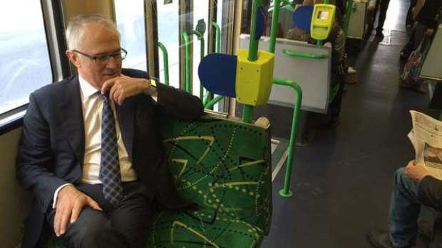 'Eerily quiet' ... Prime Minister Malcolm Turnbull rides the tram in the Docklands on Friday morning.