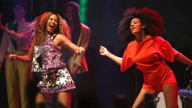 Beyonce and sister Solange perform at the Coachella festival in 2014.