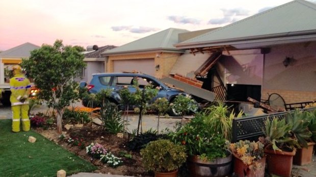 A car has ploughed into a house in Morley.