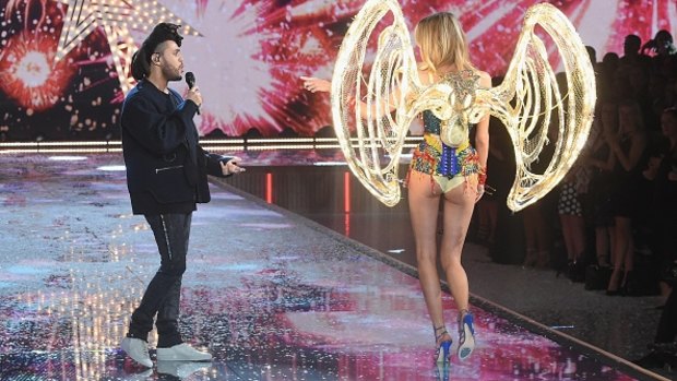 Singer The Weeknd performs during the Victoria's Secret  2015 show. Angel Martha Hunt walks the runway.