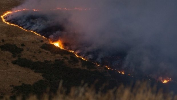 A line of fire burns across the Port Hills, south of Christchurch, on Wednesday evening.