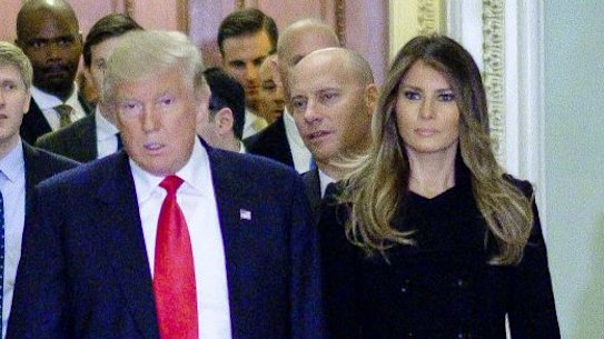 Senate Majority Leader Mitch McConnell, escorts US President-elect Donald Trump and First Lady-elect Melania Trump to a meeting at the US Capitol on Thursday. 
