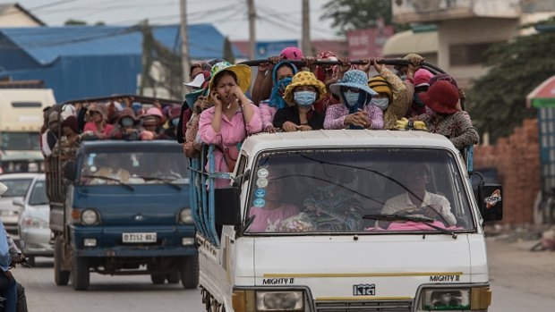 Thousands of workers every day cram together in trucks from the provinces to work in the many garment factories in Phnom Penh, Cambodia.
