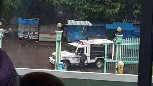 Islamic State flags can be seen on vehicles on the streets of Marawi. 