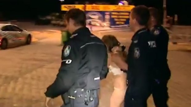 A woman was arrested in her underwear after driving a ute into the river at the Gold Coast.