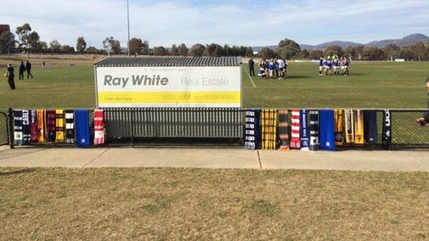People put their scarves out at Greenway Oval to honour Adelaide Crows coach Phil Walsh.