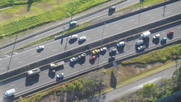 A five car nose-to-tail crash on the Pacific Motorway at Loganholme has caused heavy delays for commuters on Wednesday morning.