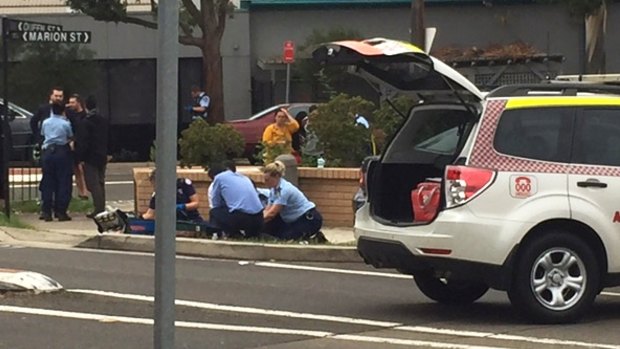 Paramedics treat a child, who was hit by a car in Auburn.