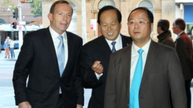 Huang Xiangmo (R) with former prime minister Tony Abbott.