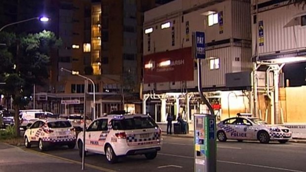 Police swooped on the apartment block near Kelvin Grove's Queensland University of Technology campus.