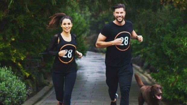 <i>Bachelor</i> star Sam Wood promoting his 28 by Sam Wood fitness program with fiancee Snezana Markoski.