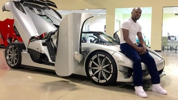 Dimaond white: Mayweather with his 'ultra boutique' ride.