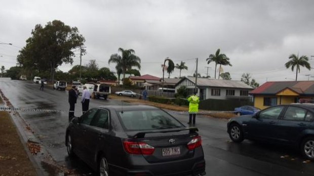 Police cordon off the scene after a man was shot by officers at Kippa Ring.