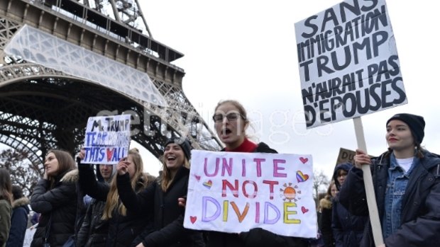 Anti-Trump protesters at the Eiffel Tower after the US president signed an executive order    banning immigration to the USA from seven Muslim-majority countries.