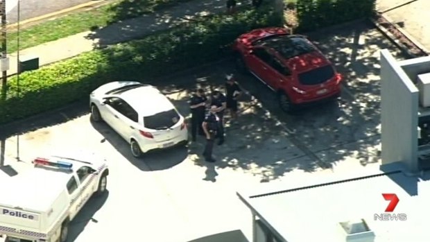 Police at a Clayfield shopping centre after a shooting on Tuesday.