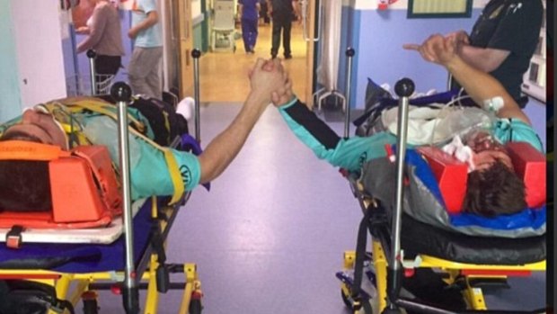 Henriques and Burns supporting each other in hospital after the collision.
