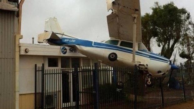 This plane was tossed onto the roof the Shine Aviation hangar at Carnarvon Airport.