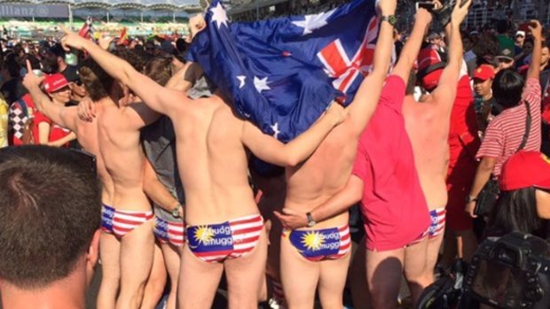 Australians arrested in Malaysia for stripping down at the Grand Prix. 