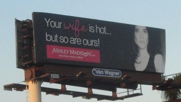A promotional billboard for the Ashley Madison dating website.
