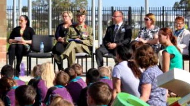 Barry Urban on Anzac Day wearing the fake medal at a school assembly.