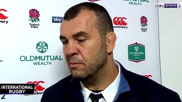 Unhappy: Wallabies coach Michael Cheika argues with a beINsports reporter.
