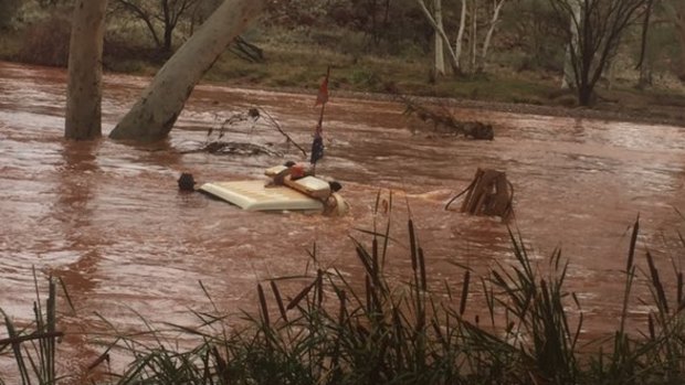 Two men were rescued from their car in Paraburdoo after the area was flooded. 