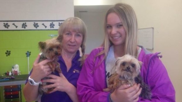 Pistol and Boo, with dog groomers Lianne and Ellie Kent, who unwittingly alerted authorities to their presence in the country.