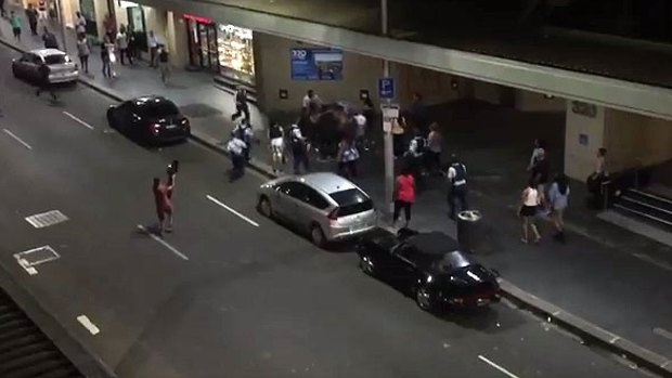 A resident filmed as the brawl broke out on the street below his apartment. 