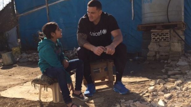 Man of the people: Sonny Bill Williams listens to Fatima's story.