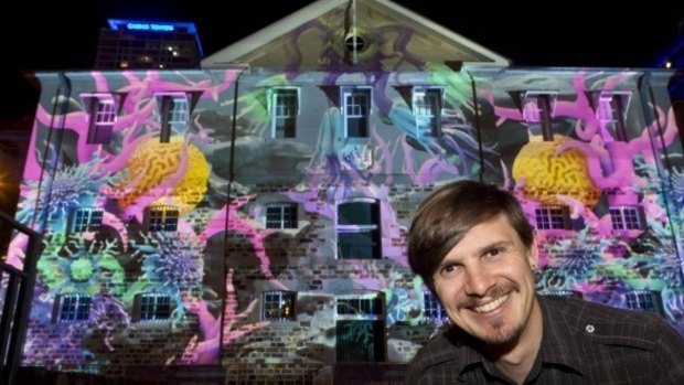 Andrew Gibbs in front of one of his light creations used during the G20.