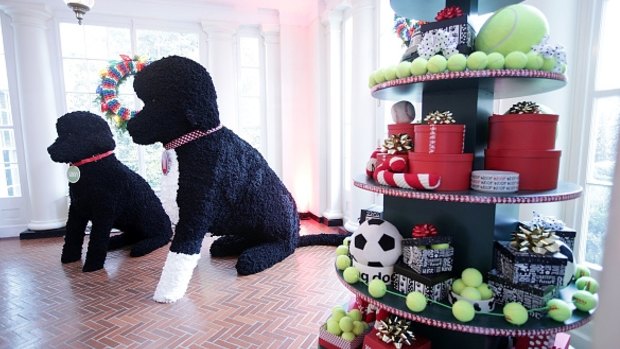 Larger-than-life pom pom replicas of presidential pups Sunny and Bo, plus a tree filled with doggie treats. 