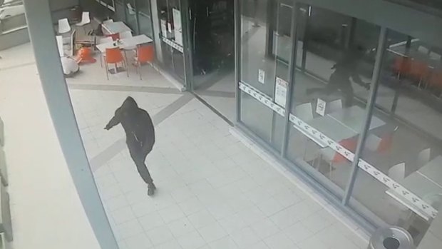 CCTV shows the moment an unidentified killer fatally shot Walid Ahmad at Bankstown Central shopping centre. 