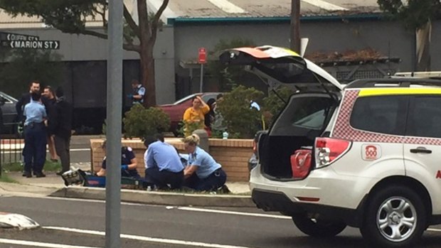 Paramedics treat a child, who was hit by a car in Auburn.