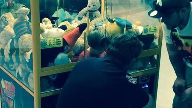 The toddler stuck in the toy machine at a Cairns shopping centre.