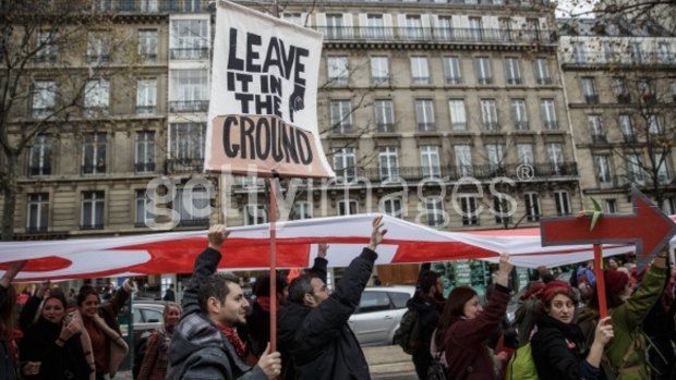 An activist holds up a poster during a demonstration.