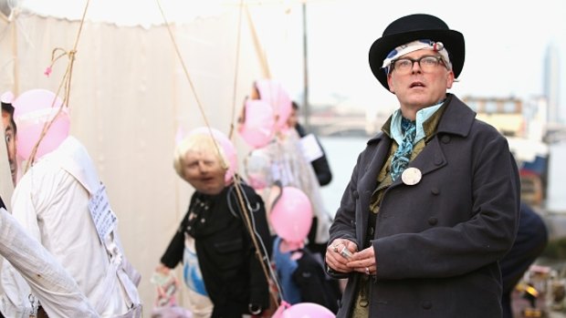 Joe Corre prepares to burn his entire punk collection on a boat on the river Thames. In the background, an effigy of Boris Johnson looks on in fear.