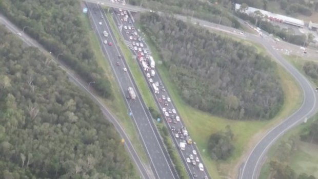 Traffic crawls past an accident on the Bruce Highway at Burpengary.