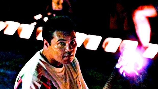 Muhammad Ali lights the Olympic Torch at Atlanta in 1996.