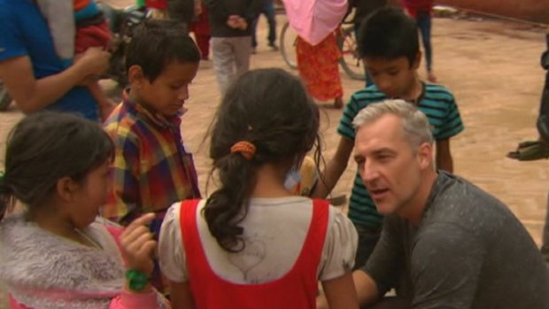 Andrew Rochford talks to children in Nepal.