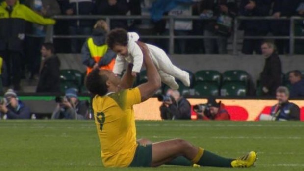 Will Genia shares his jubilation of the semi-final victory at Twickenham with baby Olivia.