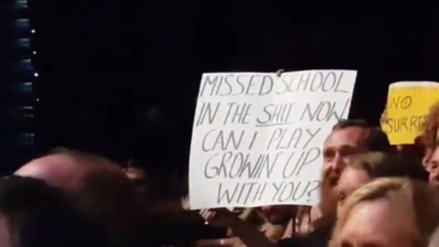 Nathan Testa held up this sign before being asked to come on stage.