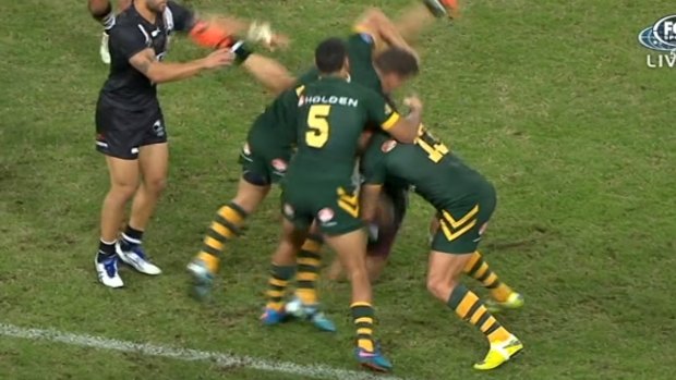 Over and out: Greg Bird dumps Jason Nightingale during the Anzac Test.