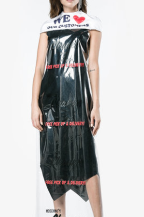 The Moschino Cape Sheer Overlay Dress as seen on Browns. 