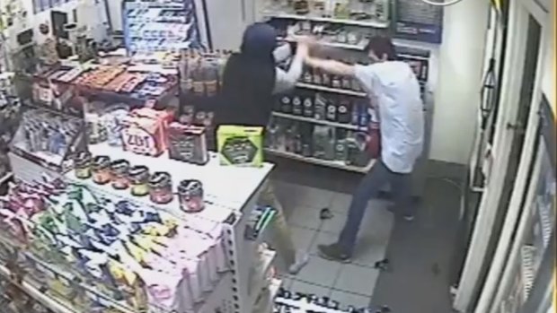 CCTV stills showing the attendant at Tarro's Metro service station as he attempts to fight back against the armed robbers.