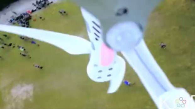 The drone spins and falls to the ground after being hit by a ball. 