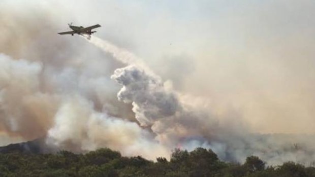 A water bomber fights a fire in Jindalee, north of Perth